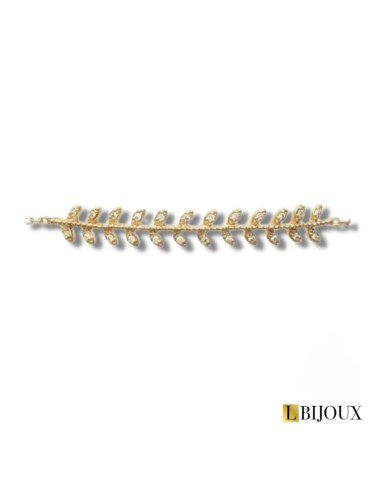 Bracelet souple en plaqué or avec au centre un branche de laurier empierrée d'oxydes. Longueur 18 cm, anneau à 16 cm.