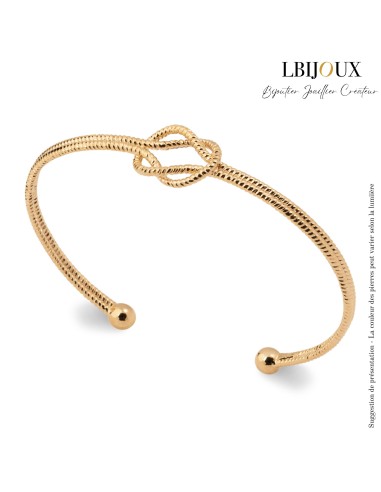 Bracelet jonc ouvert femme en plaqué or perlé avec un nœud au centre. Diamètre 58mm.