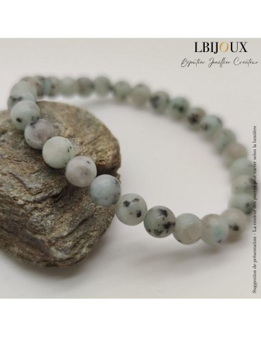 Bracelet perles de 6 mm en jaspe gris. 18 cm. Sans fermoir.